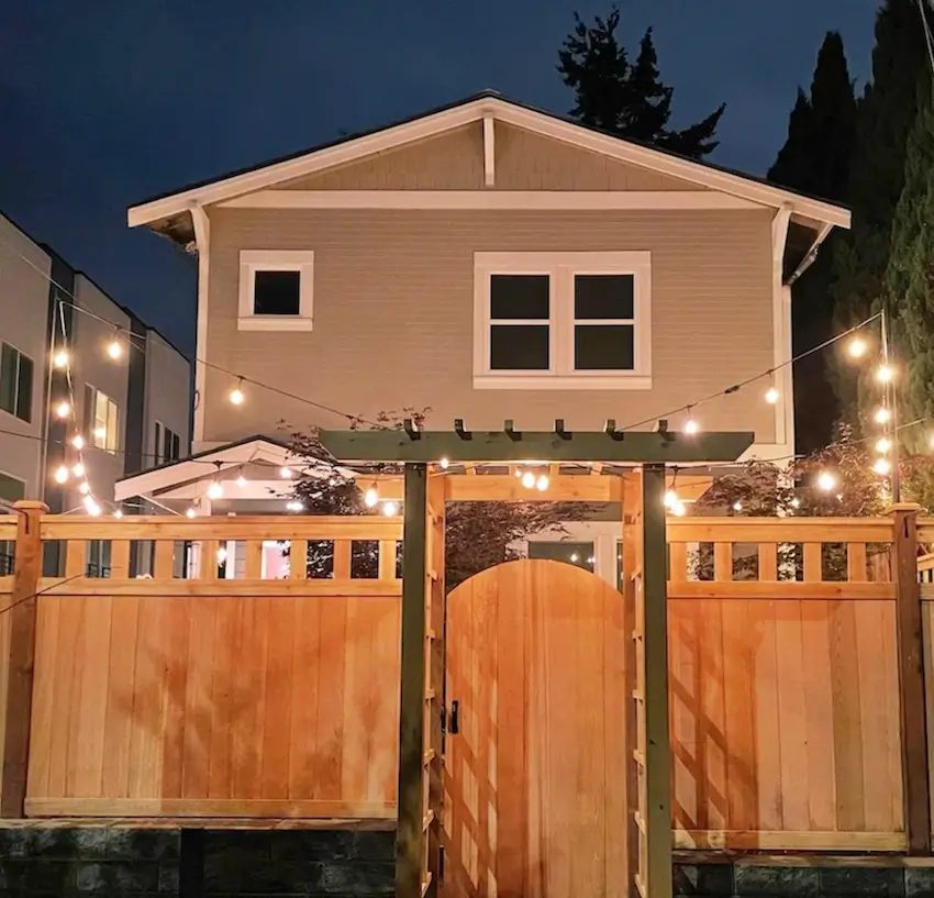 Wood privacy fence with custom gate installation for a residential home in Seattle