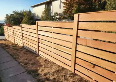 Modern horizontal wood fence installation for backyard privacy in Seattle