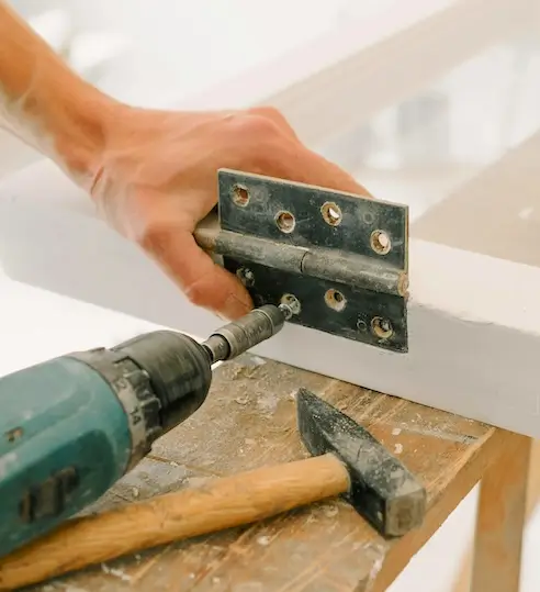 Gate hinge installation during fence repair in Seattle<br />
