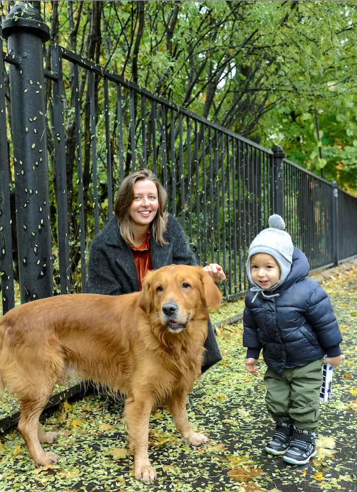 Family and dog near wildlife protection fence in Seattle neighborhood