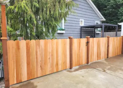 Decorative cedar wood fence with custom gate installed in Seattle