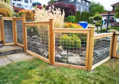 wood and wire mesh fence installation in Seattle residential area