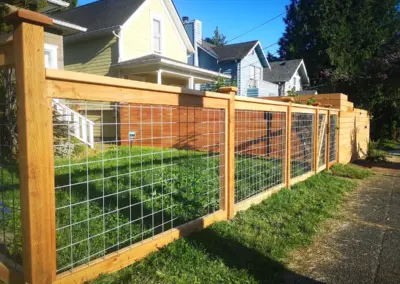 wood and wire fence with gate for residential front yard in Seattle