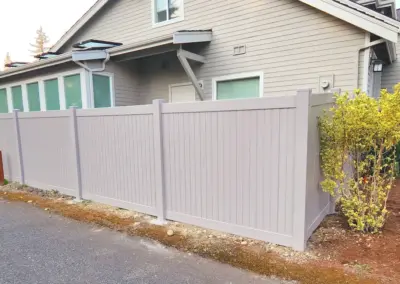 Vinyl privacy fence installation in Seattle residential backyard