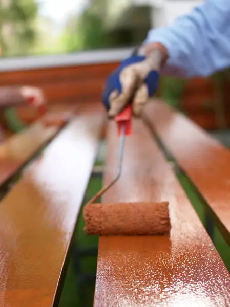 Fence repair and repainting service in Seattle restoring damaged wooden fence boards